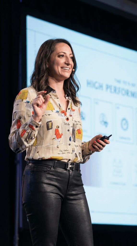 Lauren Goldstein delivering a keynote on stage