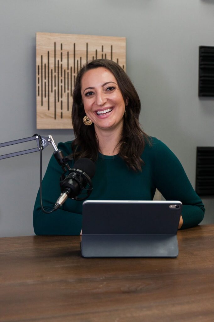 Lauren Goldstein hosting The Biz Doctor® Podcast at the microphone